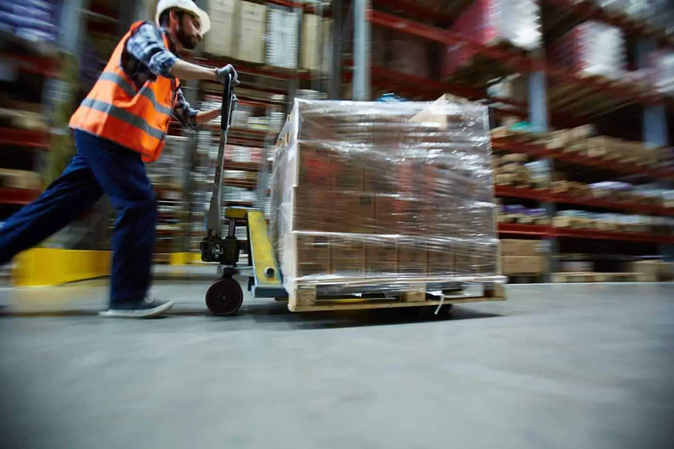 Image of distribution warehouse worker running to fulfill order